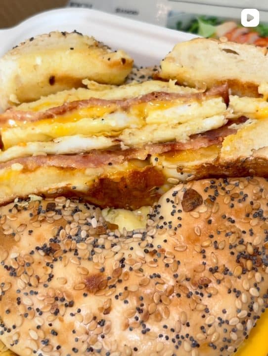 Egg, ham and cheese bagel sandwich